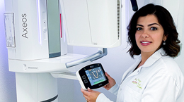 Dr. Melika Kashkouli beside her Axeos imaging system
