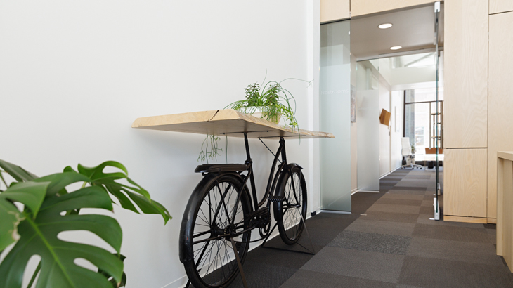 hallway shelf using a bicycle as the stand