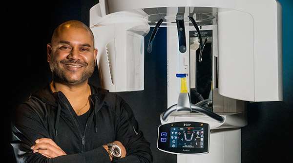 Neil Patel, DDS, CDT, with an Axeos 2D/3D imaging unit 