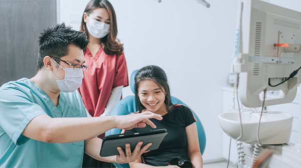 OperaDDS software being utilized with a patient at West Lakes Family Dentistry